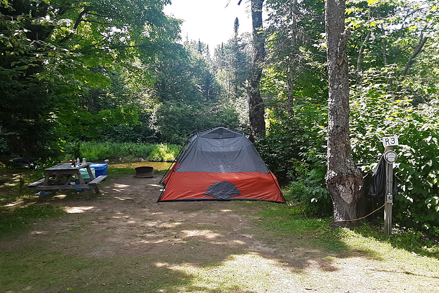 Tent on River Site at Along the River Campground & Cabins