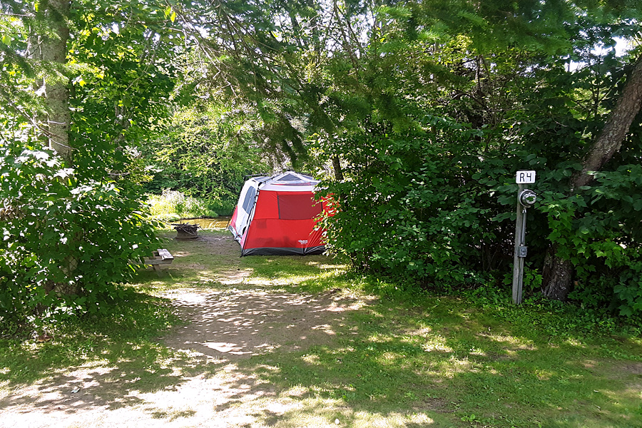 Tent on River Site at Along the River Campground & Cabins